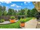 Beautifully landscaped backyard featuring mature trees and a well-manicured lawn at 3033 Daum Ct, Carmel, IN 46033