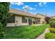 Lush landscaped backyard featuring a well-manicured lawn, mature trees and tasteful plantings at 3033 Daum Ct, Carmel, IN 46033