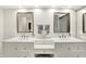 Bright bathroom with double sinks, vanity area, and modern design elements throughout at 3033 Daum Ct, Carmel, IN 46033
