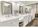 Luxurious bathroom featuring double vanities, modern mirrors, and ample storage space at 3033 Daum Ct, Carmel, IN 46033