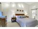Inviting bedroom featuring soft lighting, a comfortable bed, and stylish decor elements at 3033 Daum Ct, Carmel, IN 46033
