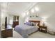Cozy bedroom with a large bed, soft lighting, and neutral decor for a relaxing retreat at 3033 Daum Ct, Carmel, IN 46033