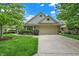 Charming single Gathering home with a manicured front yard and a two-car garage at 3033 Daum Ct, Carmel, IN 46033