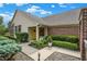 Inviting front porch with a bright yellow door, decorative wreath, and charming flower pots at 3033 Daum Ct, Carmel, IN 46033
