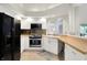 Stylish kitchen with white cabinets, stainless steel appliances, and butcher block countertops for a modern and clean look at 3033 Daum Ct, Carmel, IN 46033