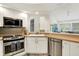 Well-lit kitchen features stainless steel appliances, stylish backsplash, and natural wood countertops at 3033 Daum Ct, Carmel, IN 46033