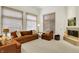 Bright living room with vaulted ceilings, neutral colors, a fireplace, large windows, and comfortable seating at 3033 Daum Ct, Carmel, IN 46033