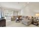 Living room featuring a sectional sofa, a television and multiple bright windows at 3033 Daum Ct, Carmel, IN 46033