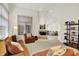 Spacious living room with vaulted ceilings, neutral colors, a fireplace, and comfortable seating arrangement at 3033 Daum Ct, Carmel, IN 46033