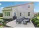 Spacious outdoor patio with comfortable seating and a view of the beautiful backyard and home at 3267 Cimmaron Ash Ct, Zionsville, IN 46077