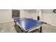 Finished basement showcasing a ping pong table, with an adjacent bathroom and an area for customs at 3267 Cimmaron Ash Ct, Zionsville, IN 46077