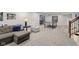 Finished basement featuring a comfortable seating area, a ping pong table, and neutral walls at 3267 Cimmaron Ash Ct, Zionsville, IN 46077