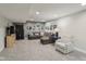 Spacious finished basement area with a cozy seating arrangement, workout equipment, and neutral paint at 3267 Cimmaron Ash Ct, Zionsville, IN 46077