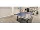 Basement featuring a ping pong table, with an open area and staircase to the upper floor at 3267 Cimmaron Ash Ct, Zionsville, IN 46077