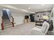 Finished basement with cozy seating area, carpet, and a staircase leading to the upper level at 3267 Cimmaron Ash Ct, Zionsville, IN 46077