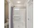 Modern bathroom with a glass door shower and a toilet at 3267 Cimmaron Ash Ct, Zionsville, IN 46077