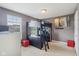 Neutral-toned bedroom showcases a unique black loft bed, with a desk area, and carpet flooring for a cozy feel at 3267 Cimmaron Ash Ct, Zionsville, IN 46077