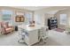 Bright bonus room featuring a large crafting table, comfortable seating, and ample natural light at 3267 Cimmaron Ash Ct, Zionsville, IN 46077