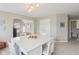 Bright bonus room featuring large table with chairs, neutral walls, and a view to the rest of the house at 3267 Cimmaron Ash Ct, Zionsville, IN 46077