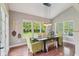 Inviting dining room features abundant natural light and views of the backyard at 3267 Cimmaron Ash Ct, Zionsville, IN 46077