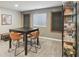 Inviting game room offers a table and chairs, chalkboard accents, and shelving for games and storage at 3267 Cimmaron Ash Ct, Zionsville, IN 46077