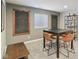 Comfortable game room features carpet flooring, a table with chairs, and convenient game storage at 3267 Cimmaron Ash Ct, Zionsville, IN 46077