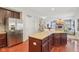 Bright kitchen boasts stainless steel appliances and opens to the cozy living area at 3267 Cimmaron Ash Ct, Zionsville, IN 46077