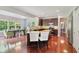 Open-concept kitchen boasts wood floors, stainless appliances, and eat-in dining area at 3267 Cimmaron Ash Ct, Zionsville, IN 46077