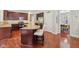 Inviting kitchen with a center island, stainless appliances, and access to the dining area at 3267 Cimmaron Ash Ct, Zionsville, IN 46077