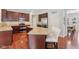 Charming kitchen with wood cabinetry, stainless appliances, and a center island at 3267 Cimmaron Ash Ct, Zionsville, IN 46077