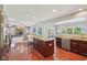 Open kitchen showcases a large island, modern appliances, and flows into living space at 3267 Cimmaron Ash Ct, Zionsville, IN 46077