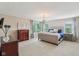 Spacious main bedroom with hardwood flooring, sitting area, and lots of light at 3267 Cimmaron Ash Ct, Zionsville, IN 46077