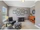 Inviting office featuring a piano and framed photos, with a cozy seating area under natural light at 3267 Cimmaron Ash Ct, Zionsville, IN 46077