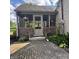 Charming back porch with brick facade and lush garden at 3559 S County Road 475 E, Plainfield, IN 46168