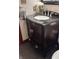 Bathroom featuring a vanity with a black countertop, a silver faucet, and decorative flowers at 3559 S County Road 475 E, Plainfield, IN 46168