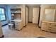 Bedroom with a built-in desk, chair, and adjacent dresser with mirror at 3559 S County Road 475 E, Plainfield, IN 46168