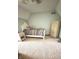 Bedroom with slanted ceilings, neutral walls, plush carpet and a quaint cottage-style bed and chest at 3559 S County Road 475 E, Plainfield, IN 46168