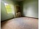 Bedroom with green walls, a large window letting in natural light, and neutral carpeted floors at 3559 S County Road 475 E, Plainfield, IN 46168