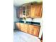 Kitchen features wood cabinets, dark countertops and tile flooring at 3559 S County Road 475 E, Plainfield, IN 46168