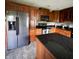 Well-equipped kitchen featuring stainless steel appliances, granite countertops, and wood cabinetry at 3559 S County Road 475 E, Plainfield, IN 46168