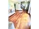 Sun-drenched living room with beautiful hardwood floors and staircase at 3559 S County Road 475 E, Plainfield, IN 46168