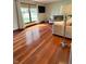 Bright living room showcases gleaming hardwood floors, large window and plush seating at 3559 S County Road 475 E, Plainfield, IN 46168
