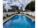 Sparkling in-ground pool with clear blue water, surrounded by a well-maintained patio at 3559 S County Road 475 E, Plainfield, IN 46168