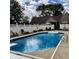 Large in-ground pool with a diving board and ample space for outdoor seating at 3559 S County Road 475 E, Plainfield, IN 46168