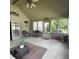 Charming screened porch with wicker furniture and views of the lush backyard at 3559 S County Road 475 E, Plainfield, IN 46168
