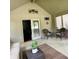 Inviting screened porch with comfortable seating, perfect for relaxing and enjoying the outdoors at 3559 S County Road 475 E, Plainfield, IN 46168