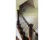 Staircase features carpet runner and ornate metal spindles with wooden handrail at 3559 S County Road 475 E, Plainfield, IN 46168