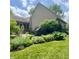 Well maintained side yard featuring lawn and extensive garden surrounding the home at 3559 S County Road 475 E, Plainfield, IN 46168