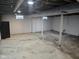 Unfinished basement space with concrete flooring and support columns at 3644 N Parker Ave, Indianapolis, IN 46218