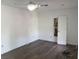 Bright bedroom with new floors, fresh white walls, ceiling fan, and new trim at 3644 N Parker Ave, Indianapolis, IN 46218
